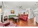 Bright and airy living room showcasing hardwood floors, a ceiling fan, and comfortable couches at 112 E Heart Pine Ln, Statesville, NC 28677