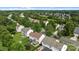 Neighborhood aerial view showcasing well-maintained homes with mature trees, lush green space and a friendly community at 11834 Planters Estates Dr, Charlotte, NC 28278