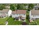 Aerial view of the backyard with a patio, gazebos, lush lawn, and a storage shed offers outdoor living at 11834 Planters Estates Dr, Charlotte, NC 28278