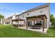A backyard featuring a patio with outdoor seating and dining area, perfect for entertaining at 11834 Planters Estates Dr, Charlotte, NC 28278