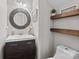 Cozy half bath with a modern vanity, decorative mirror, and stylish wall accents at 11834 Planters Estates Dr, Charlotte, NC 28278