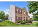 Charming brick two-story home with red shutters and manicured landscaping creates curb appeal at 11834 Planters Estates Dr, Charlotte, NC 28278