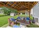 Cozy outdoor gazebo with comfortable seating, a coffee table, and decorative accents provides a relaxing space at 11834 Planters Estates Dr, Charlotte, NC 28278