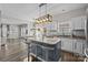 Modern kitchen features an island with barstool seating, granite countertops, and stainless steel appliances at 11834 Planters Estates Dr, Charlotte, NC 28278