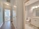 Bathroom with white vanity and cabinets, light fixtures and tile floors at 120 Prairie View Ct, Belmont, NC 28012