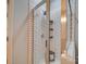 Bathroom shower with white subway tile, glass door, black stool and shelving at 120 Prairie View Ct, Belmont, NC 28012