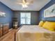 Comfortable bedroom featuring a bed, dresser, and ample natural light for a relaxing atmosphere at 120 Prairie View Ct, Belmont, NC 28012