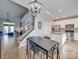Open-concept dining area adjoining kitchen and Gathering room with staircase nearby at 120 Prairie View Ct, Belmont, NC 28012