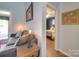 Cozy living room showcasing a comfortable sofa and stylish decor with a view into the bedroom at 120 Prairie View Ct, Belmont, NC 28012