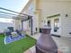 Cozy backyard patio with seating, pergola, artificial turf and a modern fire pit, perfect for outdoor gatherings at 120 Prairie View Ct, Belmont, NC 28012