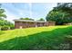 Expansive backyard with well-maintained lawn and brick home exterior at 1211 25Th Se St, Hickory, NC 28602
