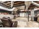 Unfinished basement with exposed ductwork, concrete floor, and a comfortable recliner, offering potential for customization at 1211 25Th Se St, Hickory, NC 28602