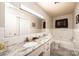 Bright bathroom featuring double sinks, modern countertops, white tile, and ample counter space at 1211 25Th Se St, Hickory, NC 28602