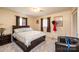 Charming bedroom with a cozy queen bed, carpeted floor, and natural light from the windows at 1211 25Th Se St, Hickory, NC 28602