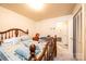 Bright bedroom with wood-framed bed, neutral walls, and carpet, creating a cozy atmosphere at 1211 25Th Se St, Hickory, NC 28602