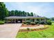 Charming brick home with well-manicured landscaping, inviting walkway, and attached carport at 1211 25Th Se St, Hickory, NC 28602