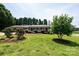 Quaint brick home featuring a large lawn and well maintained landscaping at 1211 25Th Se St, Hickory, NC 28602