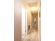 Clean hallway with light gray wood floors, neutral walls, and white trim for a modern look at 1211 25Th Se St, Hickory, NC 28602