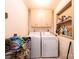 Bright laundry area features a washer, dryer, storage cabinets, and a built in shelf at 1211 25Th Se St, Hickory, NC 28602