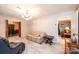 Living room with neutral walls, light floors, and views into an adjacent dining area at 1211 25Th Se St, Hickory, NC 28602
