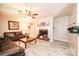 Spacious living room featuring a brick fireplace, leather furniture, and wood-look flooring, providing a warm and inviting space at 1211 25Th Se St, Hickory, NC 28602