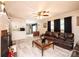 Inviting living room with a cozy fireplace, leather furniture, wood-look floors, and an open view to the kitchen at 1211 25Th Se St, Hickory, NC 28602