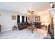 Comfortable living room with leather sofas, wood-look floors, and natural light streaming through the windows at 1211 25Th Se St, Hickory, NC 28602