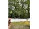Private backyard with lush greenery and a sturdy white fence, perfect for relaxation at 13116 Erwin Rd, Charlotte, NC 28273