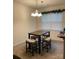 Cozy dining area featuring a modern table set and decorative garland over the window at 13116 Erwin Rd, Charlotte, NC 28273