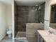 Modern bathroom featuring a glass enclosed shower, and a marble-top vanity with new lighting at 138 Zircon Dr, Statesville, NC 28625