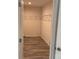 Spacious walk-in closet featuring wire shelving and new hardwood flooring at 138 Zircon Dr, Statesville, NC 28625