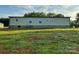 Exterior of home featuring vinyl siding, a level lot, and mature trees at 138 Zircon Dr, Statesville, NC 28625