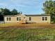 Charming single-story home featuring a covered porch and a well-maintained yard at 138 Zircon Dr, Statesville, NC 28625