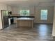 Modern kitchen with stainless steel appliances, a center island, and ample natural light at 138 Zircon Dr, Statesville, NC 28625