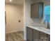 Laundry room with updated cabinets, light countertops, and a utility sink at 138 Zircon Dr, Statesville, NC 28625