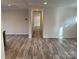 Expansive living room with hardwood floors, neutral walls, and a view into the hallway at 138 Zircon Dr, Statesville, NC 28625