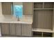Mudroom featuring updated cabinets, light countertops, and built-in storage at 138 Zircon Dr, Statesville, NC 28625
