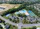 An aerial view of the community amenities, including a pool and tennis court at 1498 Burrell Nw Ave, Concord, NC 28027