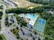 An aerial view of the community amenities, including a pool and tennis court at 1498 Burrell Nw Ave, Concord, NC 28027