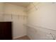 Walk-in closet with shelving for storage and organization in this spacious home at 1498 Burrell Nw Ave, Concord, NC 28027