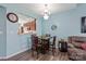Cozy dining room with a wooden table set and a charming chandelier at 1498 Burrell Nw Ave, Concord, NC 28027