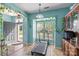 Bright exercise room featuring a treadmill, natural light, and decorative plants at 1498 Burrell Nw Ave, Concord, NC 28027