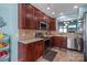 Modern kitchen features stainless steel appliances, ample countertop space, and wooden cabinets at 1498 Burrell Nw Ave, Concord, NC 28027