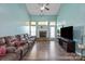 Inviting living room features a fireplace, high ceilings, and a comfortable sofa at 1498 Burrell Nw Ave, Concord, NC 28027