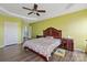 Spacious main bedroom with ample closet space, fan, and wooden furniture at 1498 Burrell Nw Ave, Concord, NC 28027