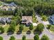 Aerial view of home with lush landscaping, charming curb appeal and long driveway at 16547 Bastille Dr, Charlotte, NC 28278