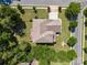 Aerial view of well-maintained home featuring an expansive lot, green lawns, and mature trees at 16547 Bastille Dr, Charlotte, NC 28278