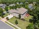 Aerial view of lovely brick home featuring large yard and outdoor wooden deck at 16547 Bastille Dr, Charlotte, NC 28278