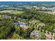 Aerial view of neighborhood featuring home at 16547 Bastile Dr surrounded by lush greenery at 16547 Bastille Dr, Charlotte, NC 28278
