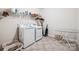 This laundry room offers plenty of storage space with multiple baskets and an overhead shelf at 16547 Bastille Dr, Charlotte, NC 28278